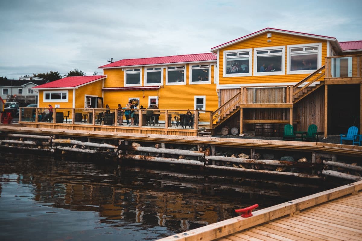 A dockside café and kiosk setup on a waterfront boardwalk